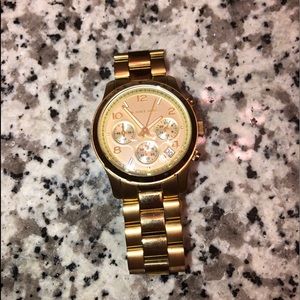 Michael Kors gold watch.